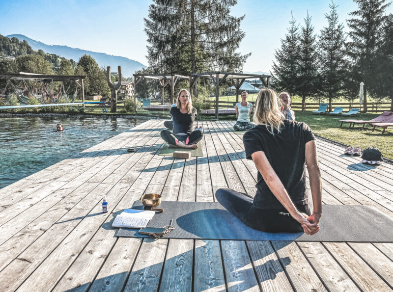 Yoga lessons at the natural swimming pool